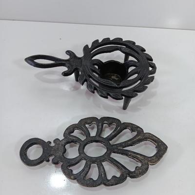 Two cast Oron trivets - Candle holder and Iron trivet