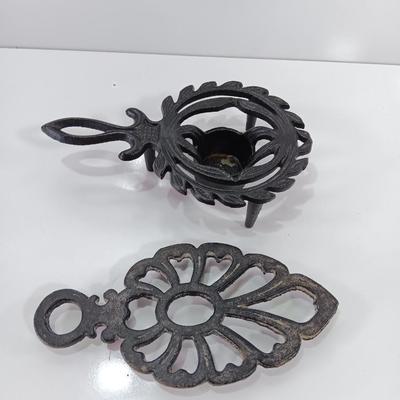 Two cast Oron trivets - Candle holder and Iron trivet