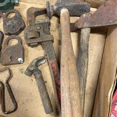 Vintage locks and shoe stretchers with hatchets