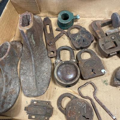 Vintage locks and shoe stretchers with hatchets