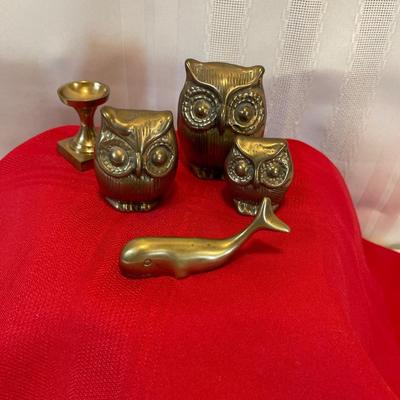 Brass owls, whale and candlestick