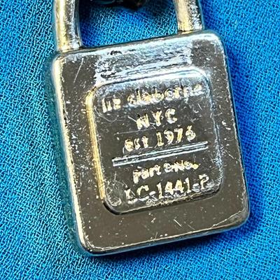 LIZ CLAIBORNE GOLD TONE PURSE TAG WITH BLACK STRAP