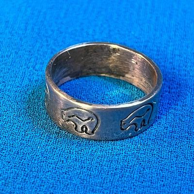 COPPER RING WITH INCISED BEAR AND ARROW SYMBOL AROUND BAND