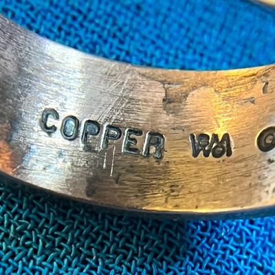 COPPER RING WITH INCISED BEAR AND ARROW SYMBOL AROUND BAND