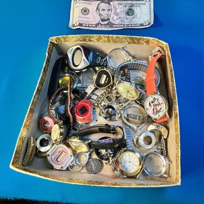 BOX FULL OF JUNQUE WATCHES, PARTS AND PIECES