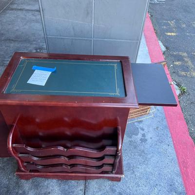 2 sided glame cabinet with leather top, small pull out writing are