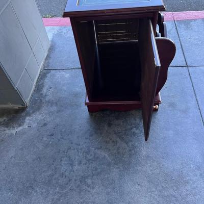 2 sided glame cabinet with leather top, small pull out writing are