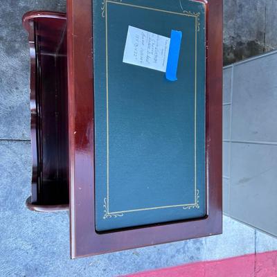 2 sided glame cabinet with leather top, small pull out writing are