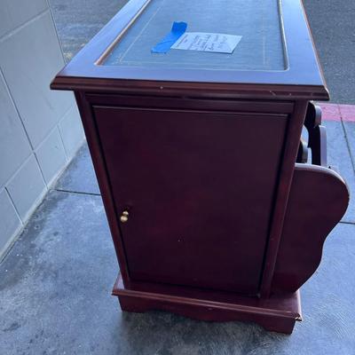 2 sided glame cabinet with leather top, small pull out writing are