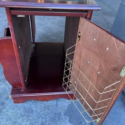 2 sided glame cabinet with leather top, small pull out writing are