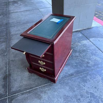 2 sided glame cabinet with leather top, small pull out writing are