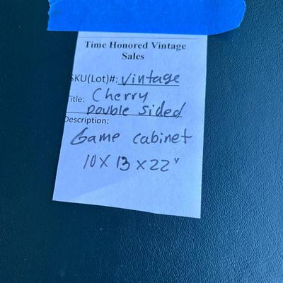 2 sided glame cabinet with leather top, small pull out writing are