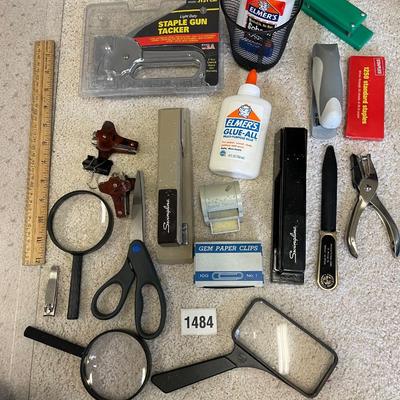 Stapler and magnifying glasses
