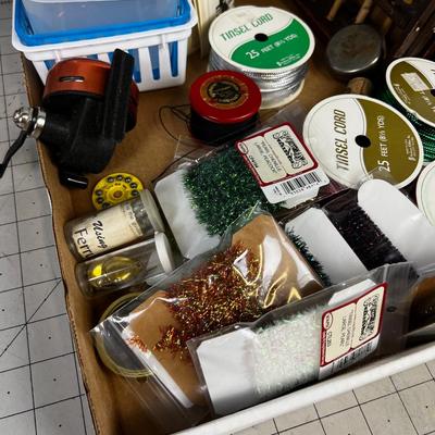Box full of Fishing Related Items: Chenille, Hooks, Yarn, Reel 