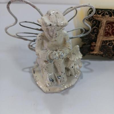 Little Angel figures ornaments and an Avon Peace candle