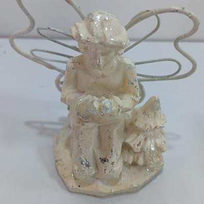 Little Angel figures ornaments and an Avon Peace candle