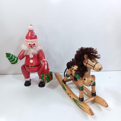 Two wooden ornaments - vintage Posable Santa and a rocking horse