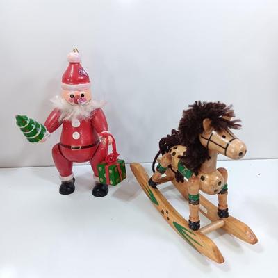Two wooden ornaments - vintage Posable Santa and a rocking horse