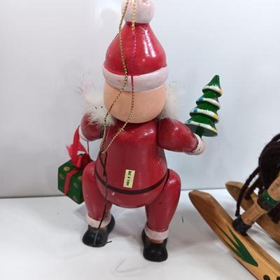 Two wooden ornaments - vintage Posable Santa and a rocking horse