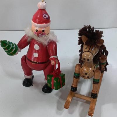 Two wooden ornaments - vintage Posable Santa and a rocking horse