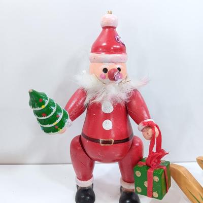 Two wooden ornaments - vintage Posable Santa and a rocking horse