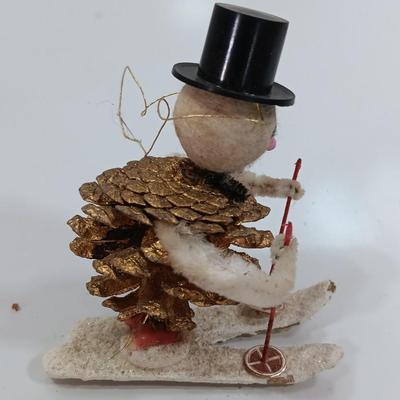 Antique pinecone Snow man skier
