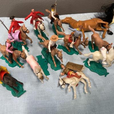 Vintage toys with plastic men on horses