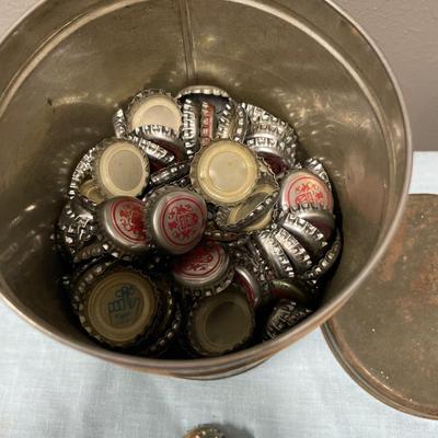 Vintage tin filled with bottle caps