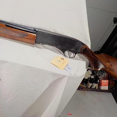 Winchester Model 1200 pump  12 gauge shot gun. est. $300 to $600.