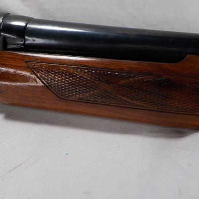 Winchester Model 1200 pump  12 gauge shot gun. est. $300 to $600.