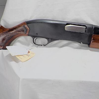 Winchester Model 1200 pump  12 gauge shot gun. est. $300 to $600.