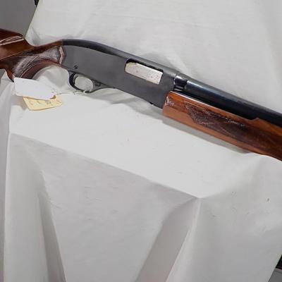 Winchester Model 1200 pump  12 gauge shot gun. est. $300 to $600.