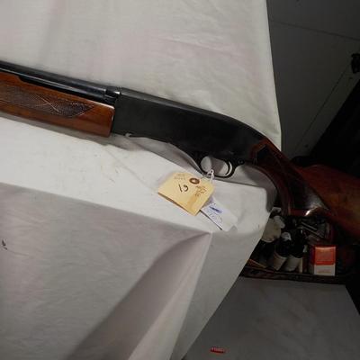 Winchester Model 1200 pump  12 gauge shot gun. est. $300 to $600.