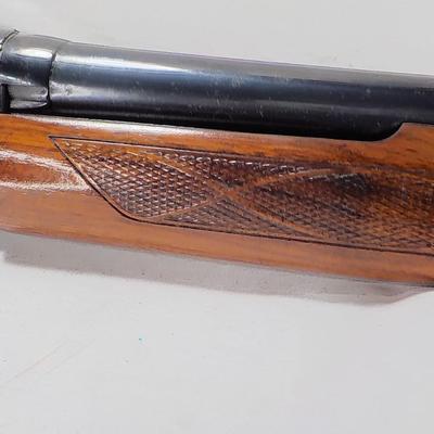 Winchester Model 1200 pump  12 gauge shot gun. est. $300 to $600.
