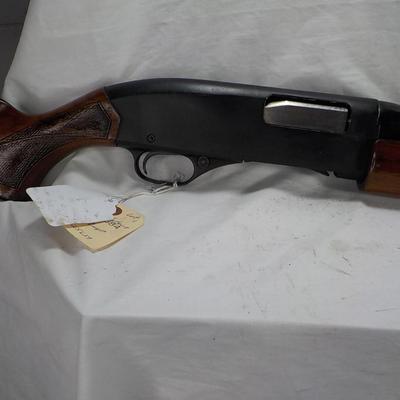 Winchester Model 1200 pump  12 gauge shot gun. est. $300 to $600.