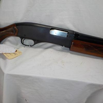 Winchester Model 1200 pump  12 gauge shot gun. est. $300 to $600.