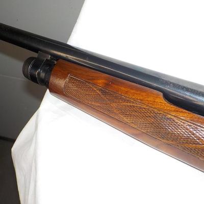 Winchester Model 1200 pump  12 gauge shot gun. est. $300 to $600.