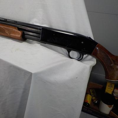 Revelation 12 gauge pump Shotgun (Mossberg) 2 3/4 & 3in shells. est $200 to $400.