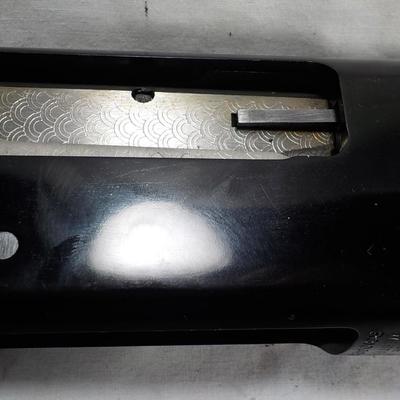 Revelation 12 gauge pump Shotgun (Mossberg) 2 3/4 & 3in shells. est $200 to $400.