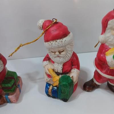 Five Ceramic Santa ornaments