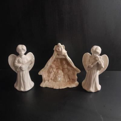 Two porcelain Angel candle holders and a vintage porcelain nativity scene