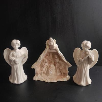 Two porcelain Angel candle holders and a vintage porcelain nativity scene