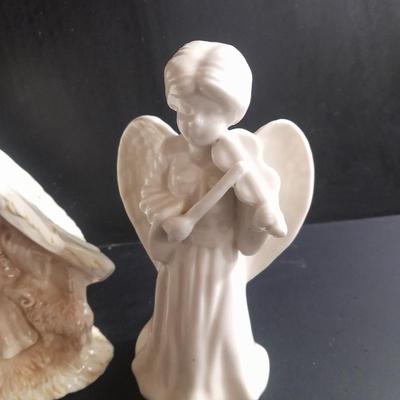 Two porcelain Angel candle holders and a vintage porcelain nativity scene