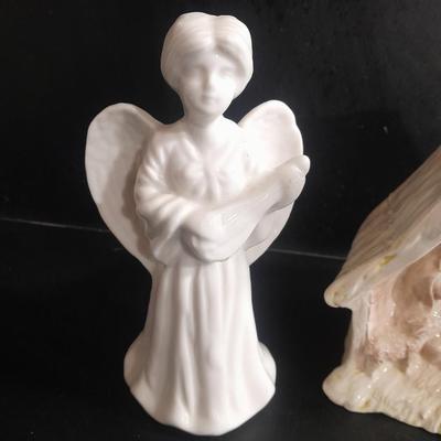 Two porcelain Angel candle holders and a vintage porcelain nativity scene