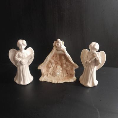 Two porcelain Angel candle holders and a vintage porcelain nativity scene