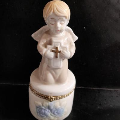 Porcelain praying hands with small ring box with religious angel on top