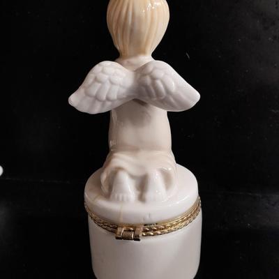 Porcelain praying hands with small ring box with religious angel on top
