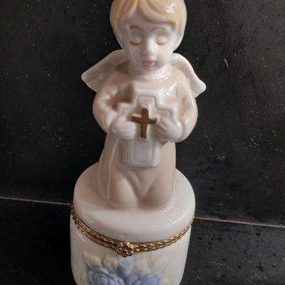 Porcelain praying hands with small ring box with religious angel on top