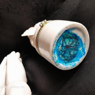 Porcelain praying hands with small ring box with religious angel on top
