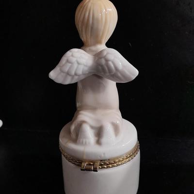 Porcelain praying hands with small ring box with religious angel on top